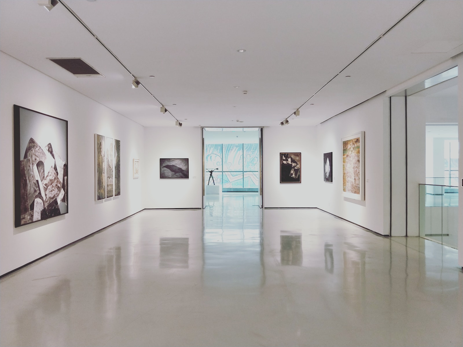 Photo by Dannie Jing assorted paintings on white painted wall